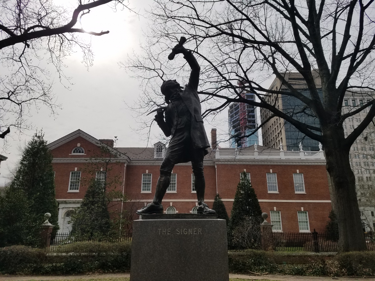 The statue of "The Signer" in Signers' Garden is based upon George Clymer